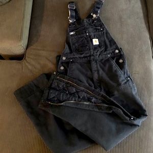 Black insulated Carhartt bibs